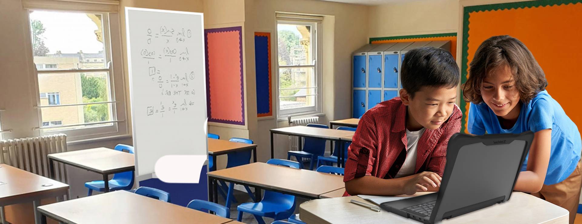 Two young kids on a Chromebook in a K12 classroom doing schoolwork